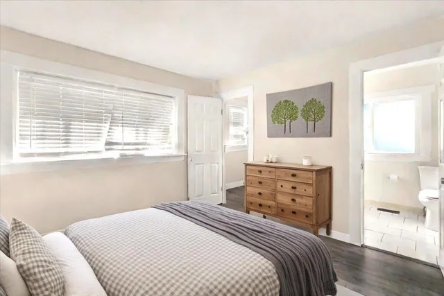 a bedroom with a bed and a dresser