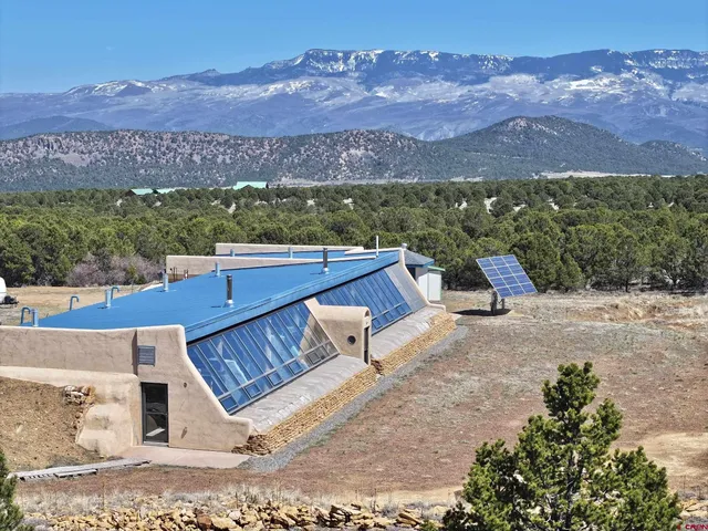 an aerial view of a house with a garden