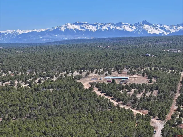 a view of an chairs and table in the balcony