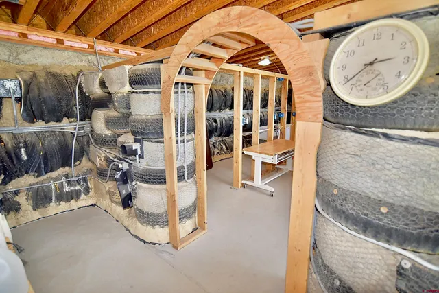 a view of a hallway with wooden walls