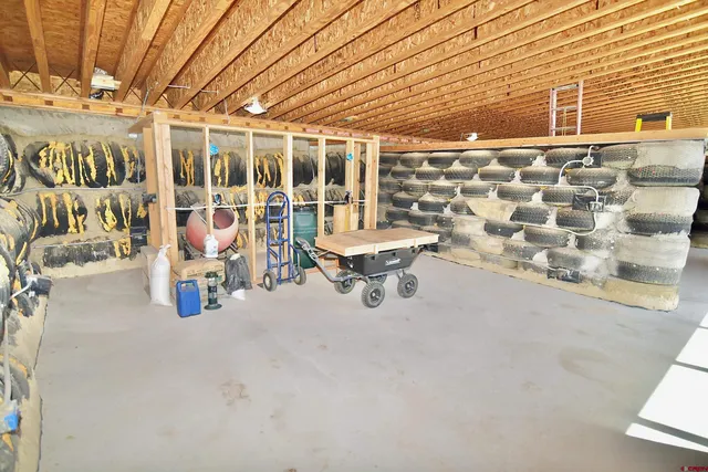 a view of a patio with table and chairs and potted plants
