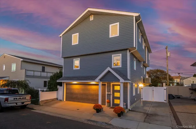 a front view of a house with parking area
