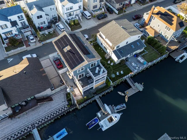an aerial view of a residential apartment building with parking area