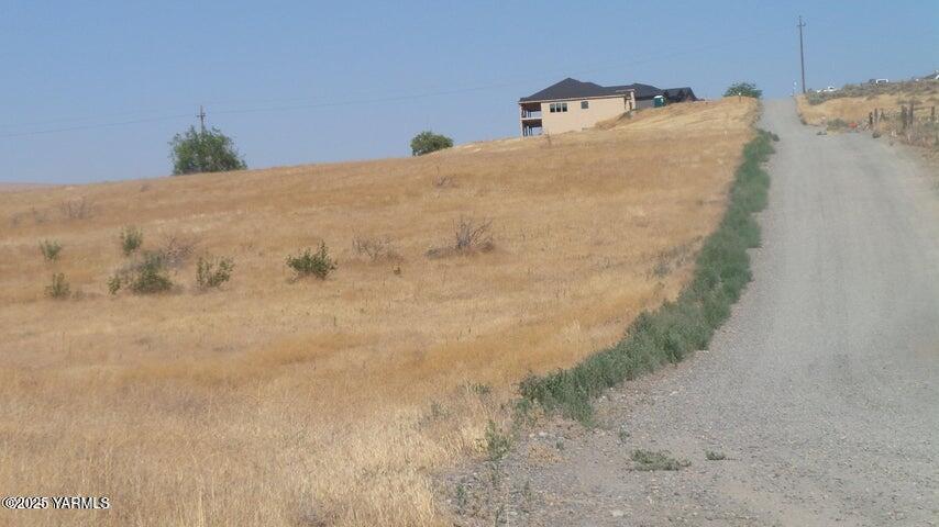 Nna Nna Cheyne Rd/falcon Ridge Road Zillah, WA 98953 - Photo 10 of 38 a bed sitting in a bedroom next to a wall