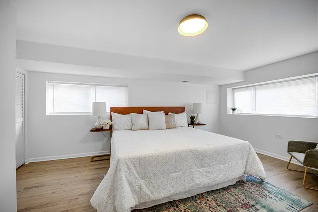 a bedroom with a bed and window