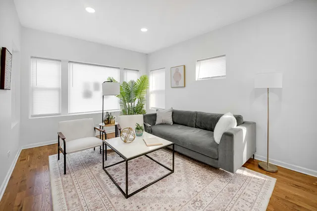 a living room with furniture and a rug