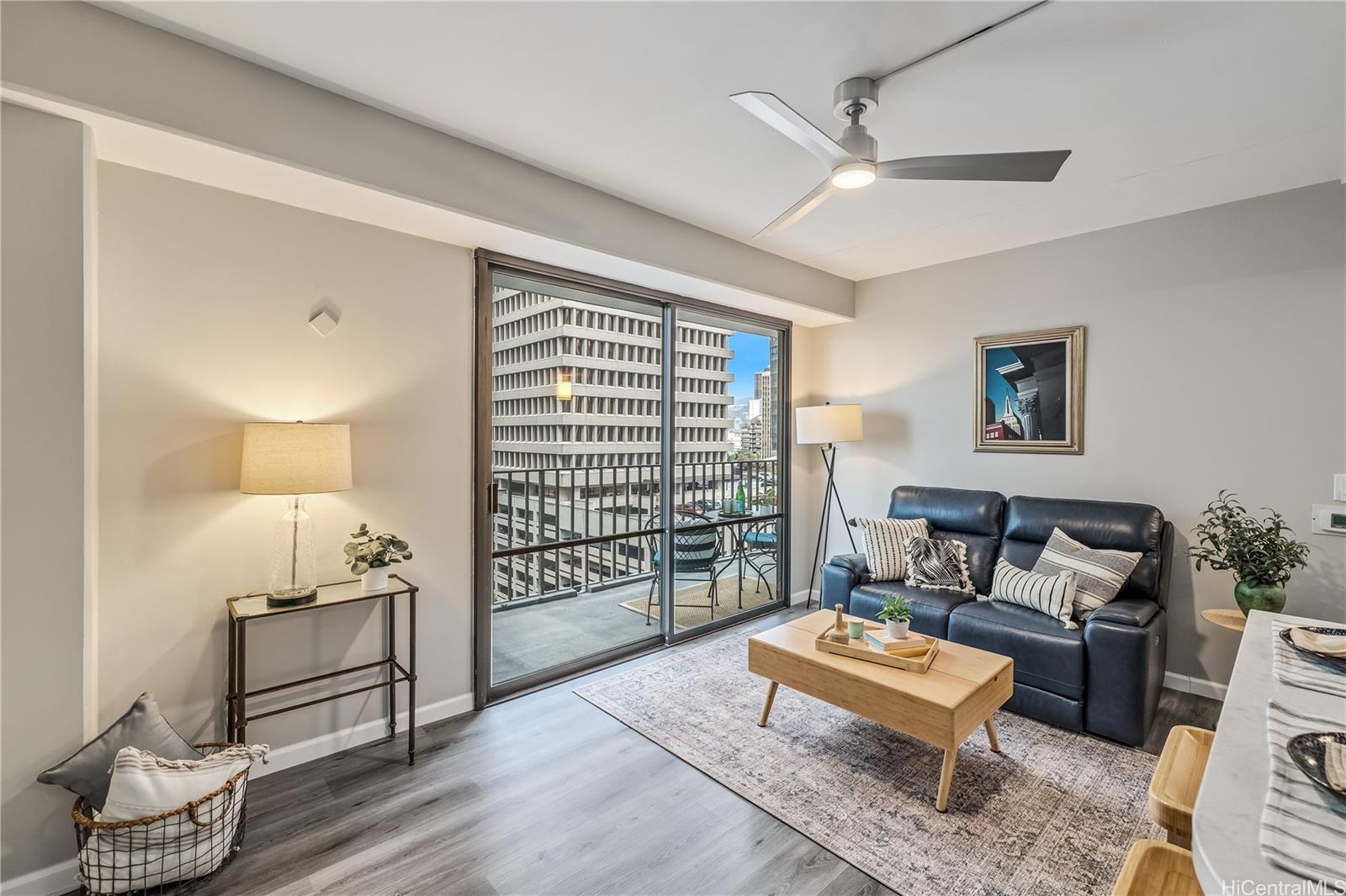 225 Queen Street, Unit 9G Honolulu, HI 96813 - Photo 1 of 1 a bedroom with furniture and a wooden floor