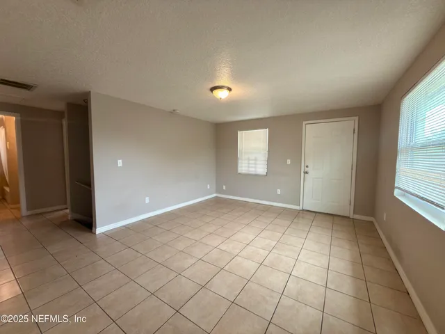 a view of an empty room and window