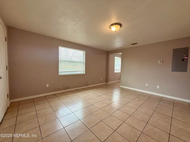 a view of an empty room and window