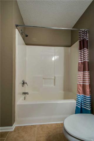 205 Ruf Drive Oak Grove, KY 42262 - Photo 16 of 20 a bathroom with a toilet and a bathtub