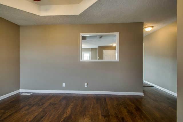 205 Ruf Drive Oak Grove, KY 42262 - Photo 3 of 20 a view of an empty room with wooden floor and a window