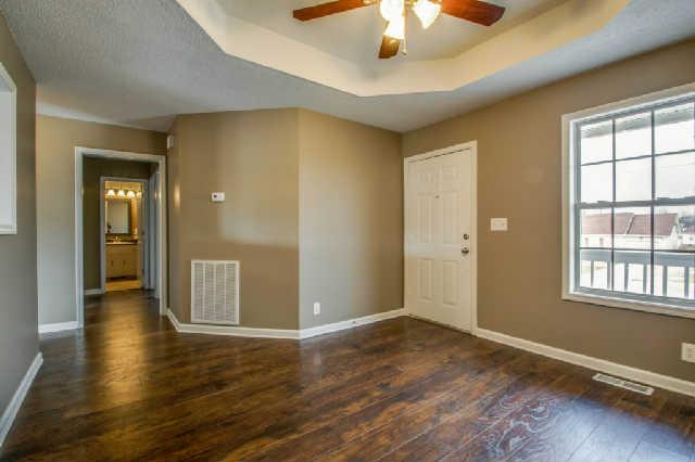 205 Ruf Drive Oak Grove, KY 42262 - Photo 4 of 20 wooden floor in an empty room with a window
