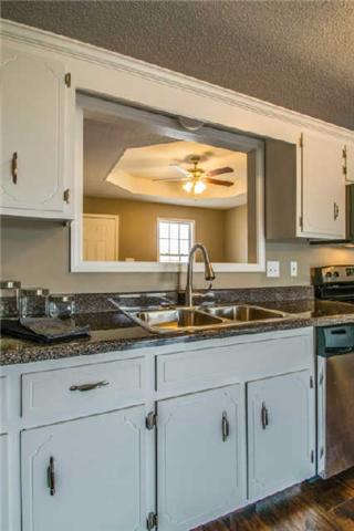 205 Ruf Drive Oak Grove, KY 42262 - Photo 8 of 20 a kitchen with stainless steel appliances granite countertop a sink and a stove