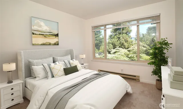 a living room with furniture a lamp and a window