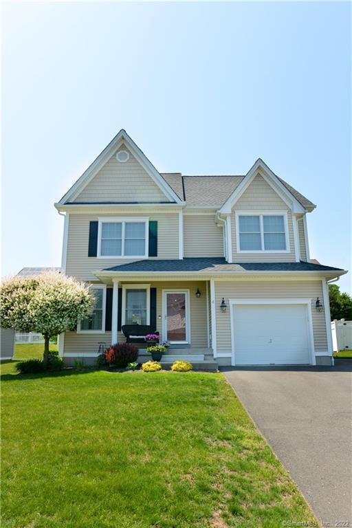 4 Mill Road Plainville, CT 06062 - Photo 1 of 1 a front view of a house with a yard and trees