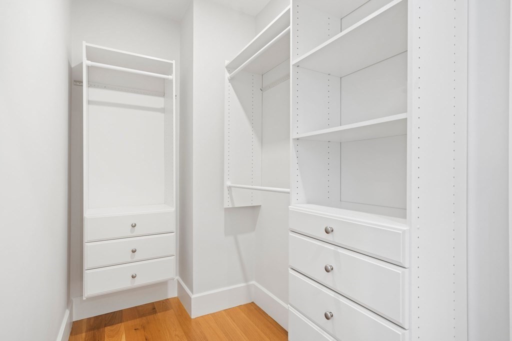 9 Glover Court, Unit 6 Boston, MA 02127 - Photo 15 of 34 a view of walk in closet with empty racks