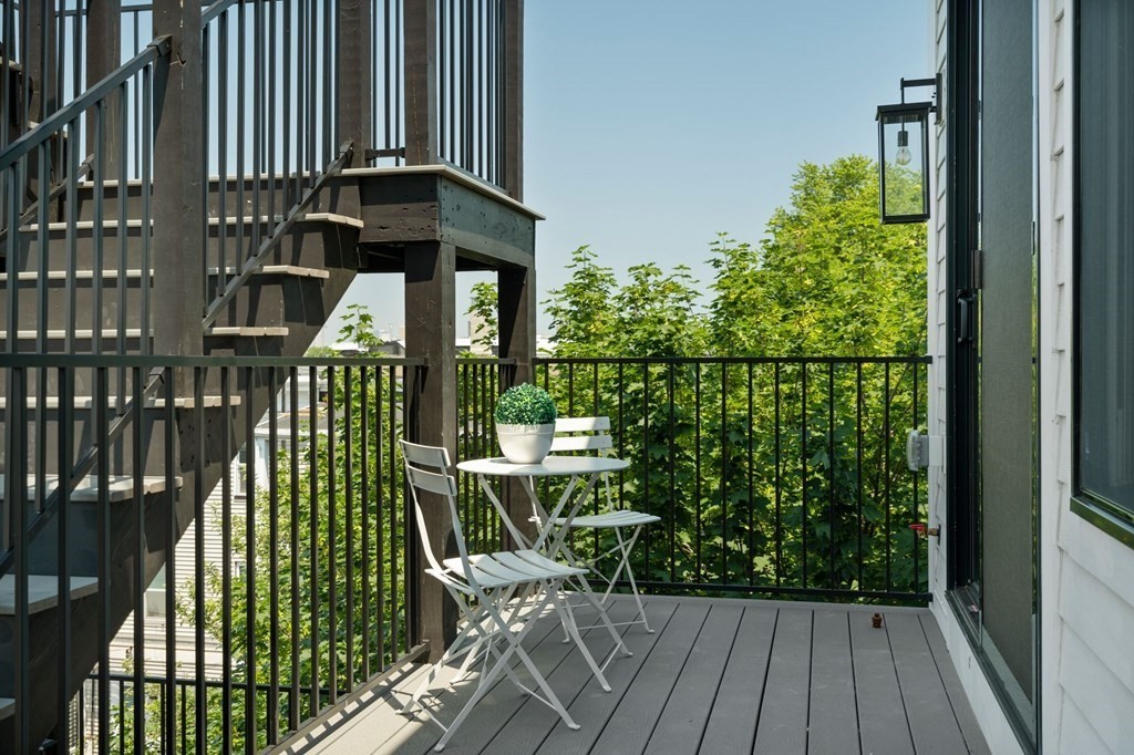 9 Glover Court, Unit 6 Boston, MA 02127 - Photo 24 of 34 a view of balcony with wooden floor