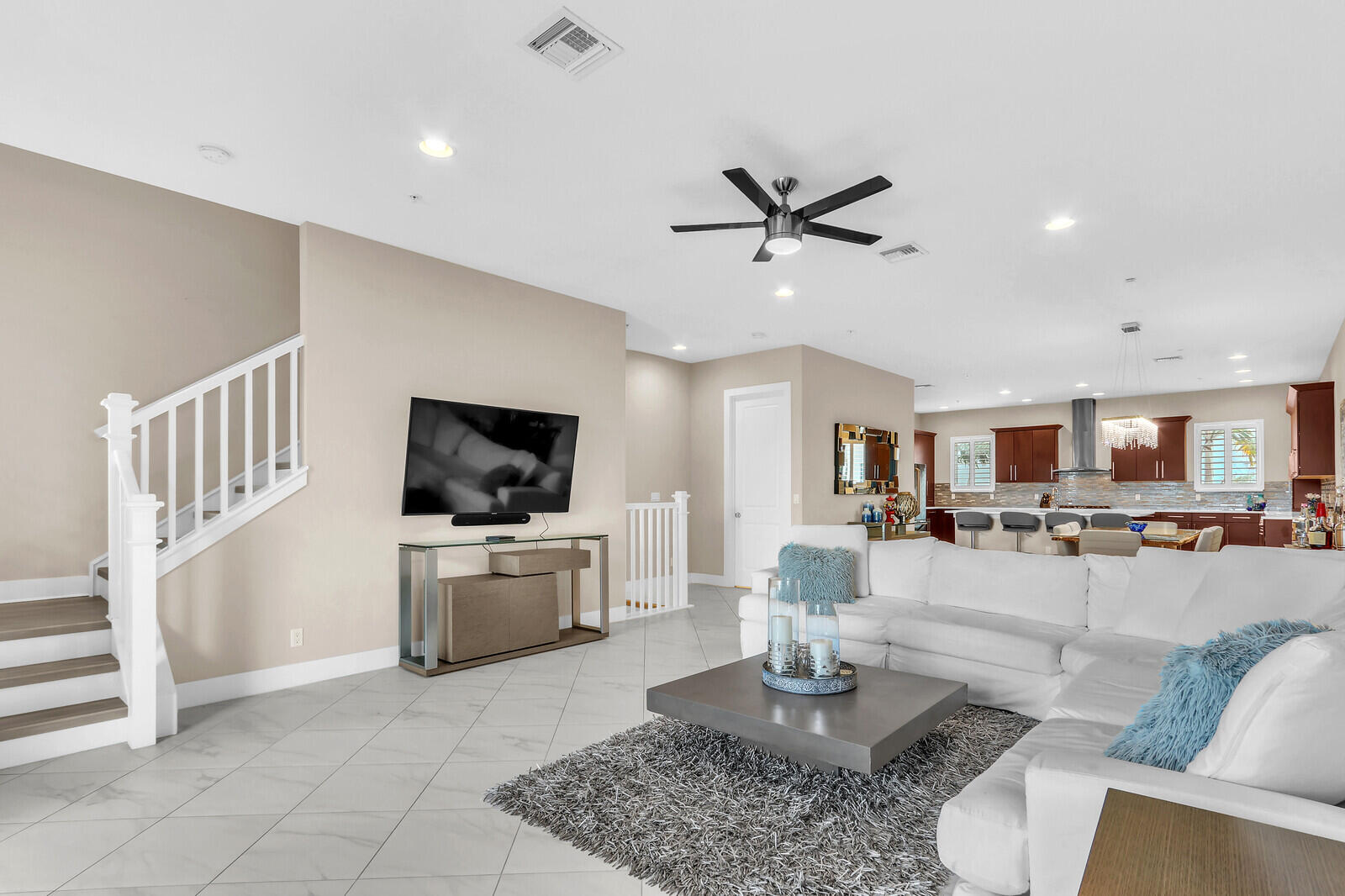 a living room with furniture and a flat screen tv