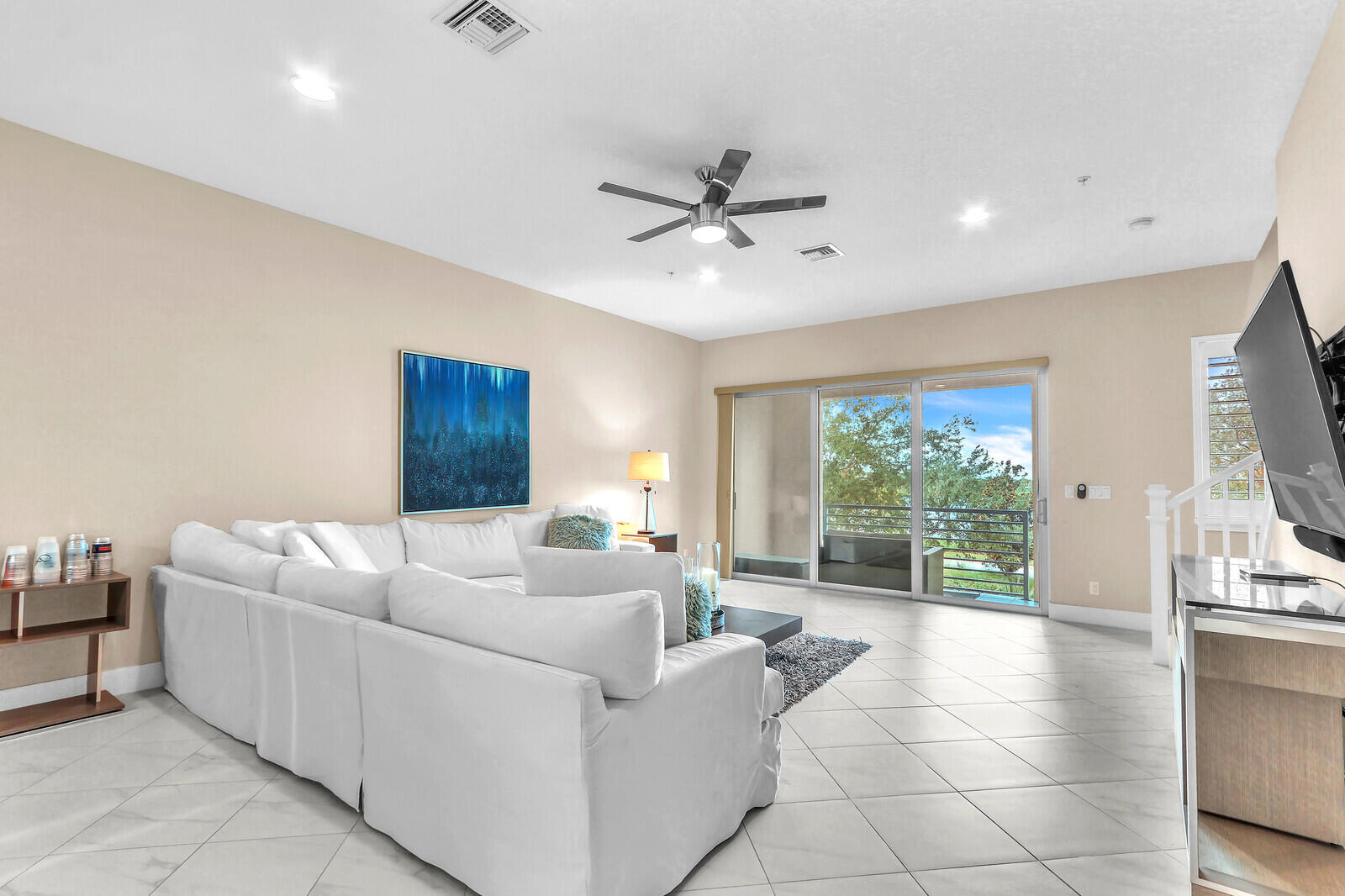 13332 Alton Road Palm Beach Gardens, FL 33418 - Photo 11 of 53 a living room with furniture and a flat screen tv