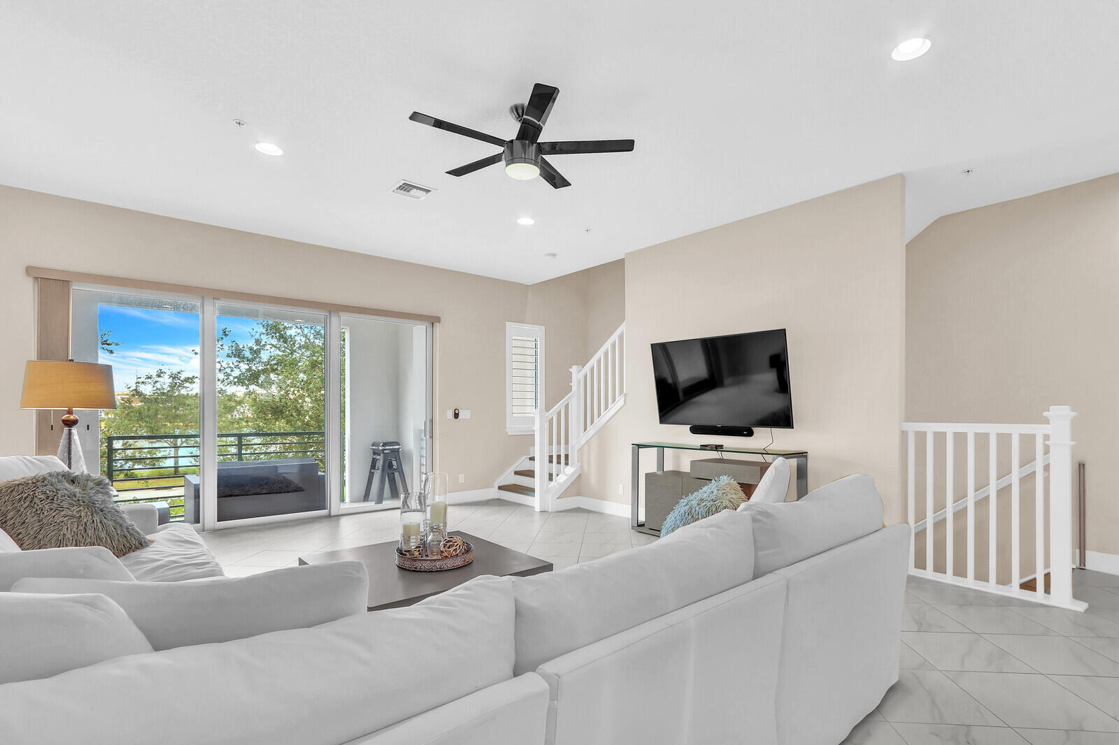 13332 Alton Road Palm Beach Gardens, FL 33418 - Photo 12 of 53 a living room with furniture and a flat screen tv