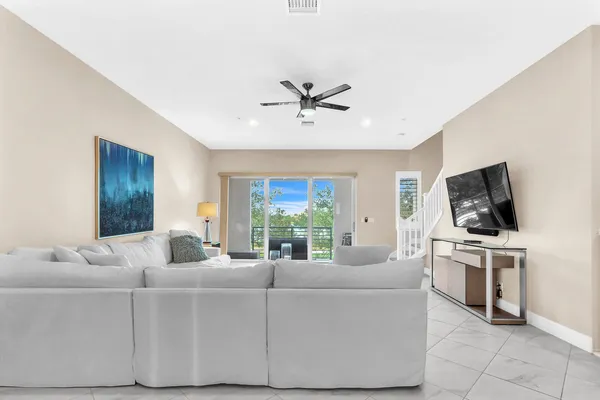 a living room with furniture and a rug