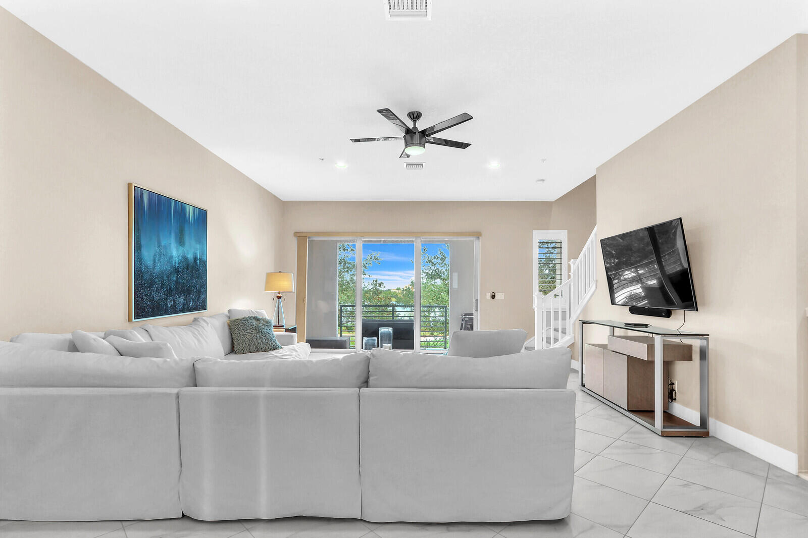 13332 Alton Road Palm Beach Gardens, FL 33418 - Photo 13 of 53 a living room with furniture and a flat screen tv