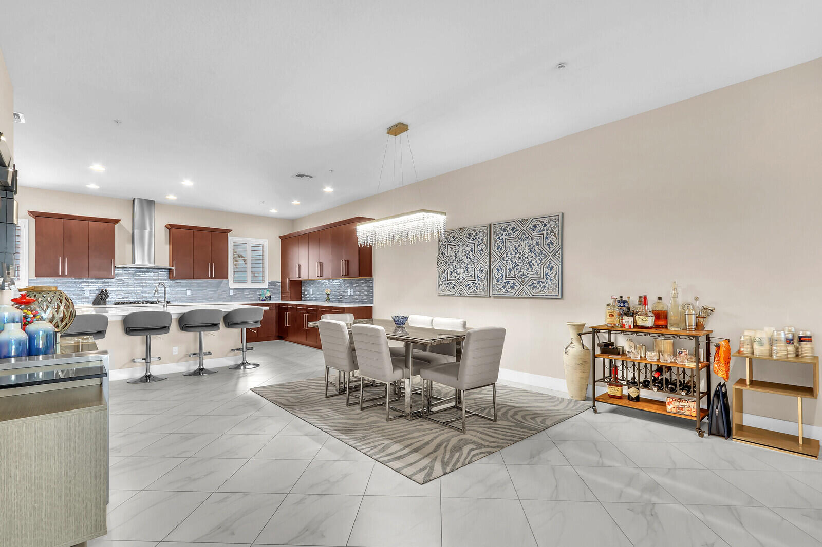 13332 Alton Road Palm Beach Gardens, FL 33418 - Photo 15 of 53 a living room with furniture and a dining table with chairs