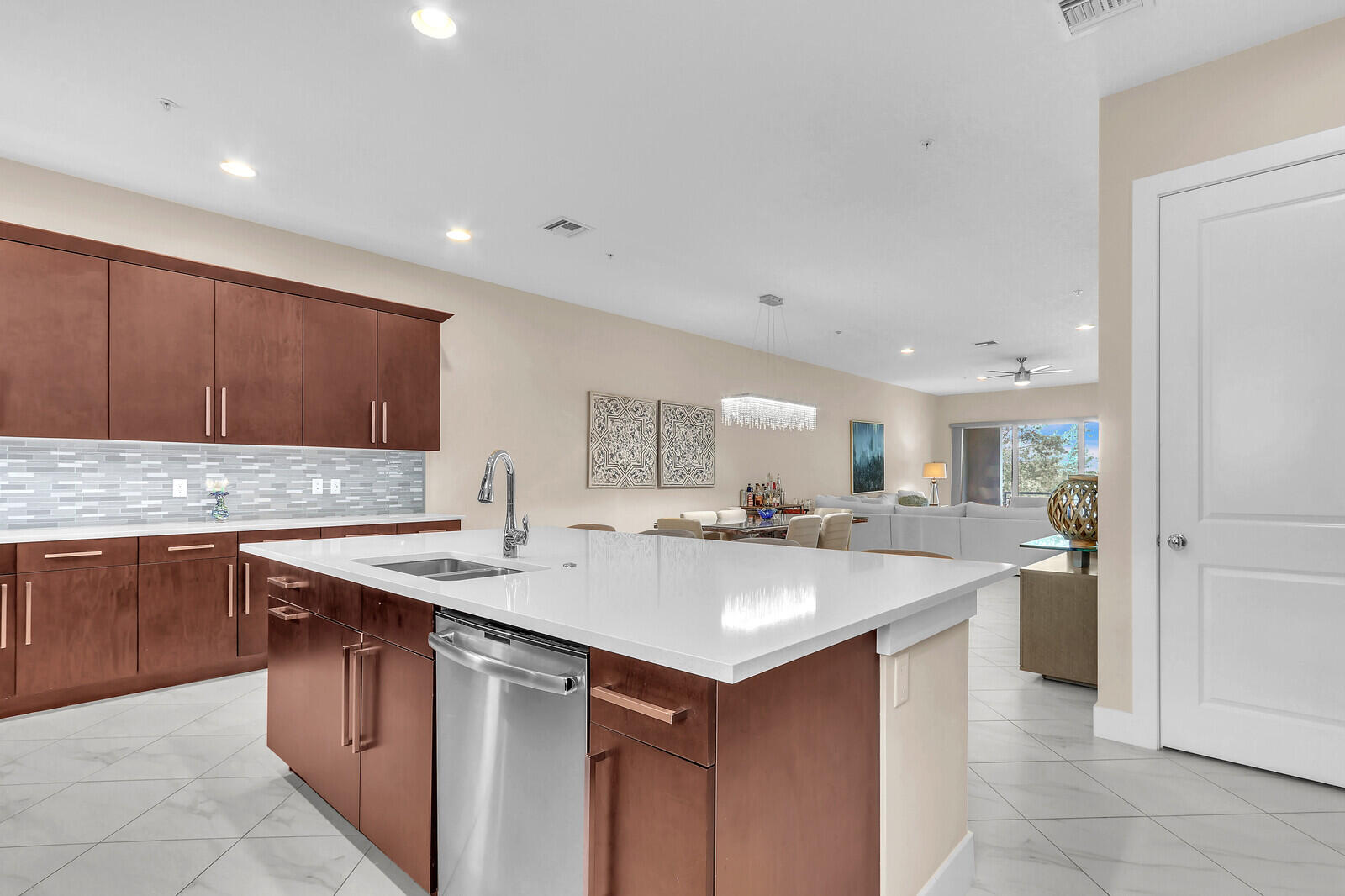 13332 Alton Road Palm Beach Gardens, FL 33418 - Photo 22 of 53 a kitchen with a sink stove and cabinets