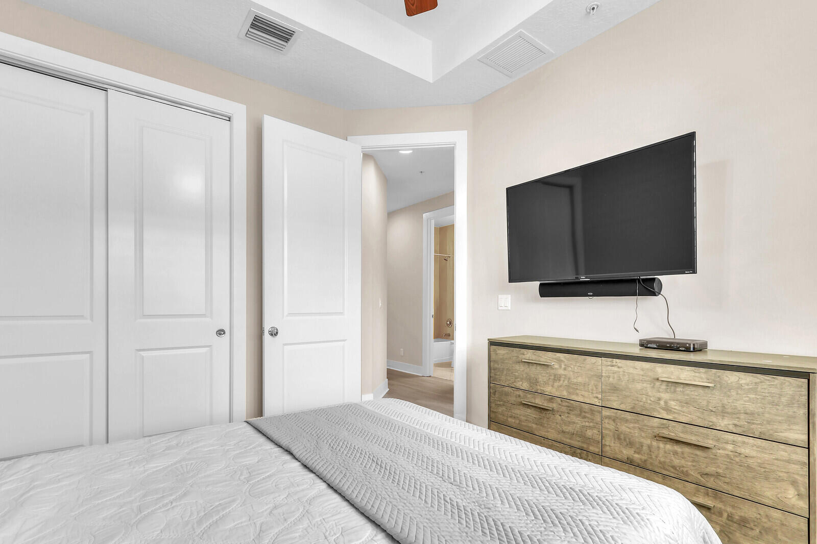 13332 Alton Road Palm Beach Gardens, FL 33418 - Photo 38 of 53 a bedroom with a bed and a flat screen tv