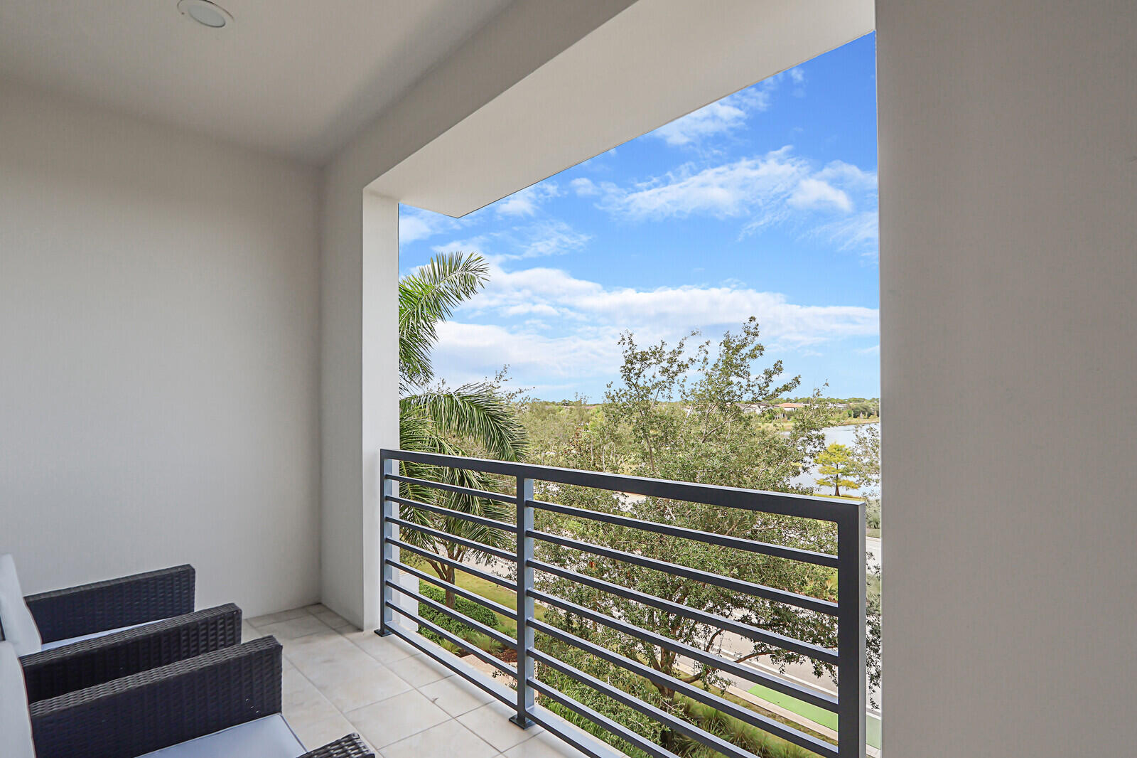 13332 Alton Road Palm Beach Gardens, FL 33418 - Photo 43 of 53 a view of a balcony with wooden floor and city view