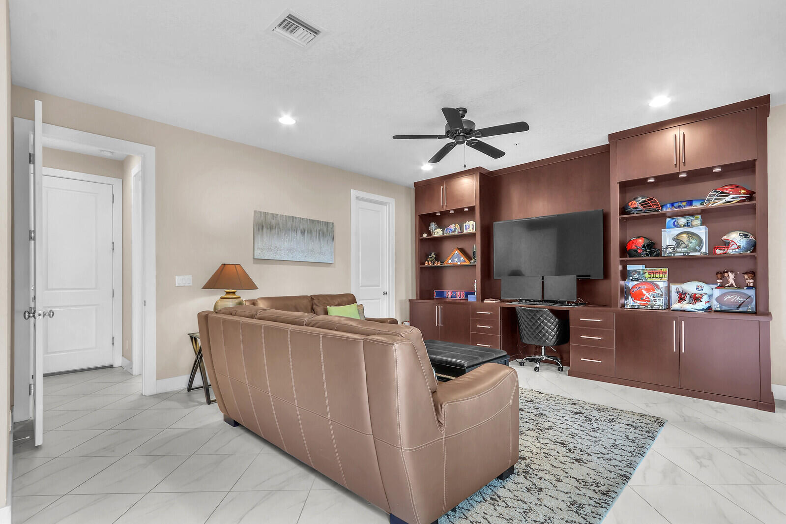 13332 Alton Road Palm Beach Gardens, FL 33418 - Photo 6 of 53 a living room with furniture and a flat screen tv