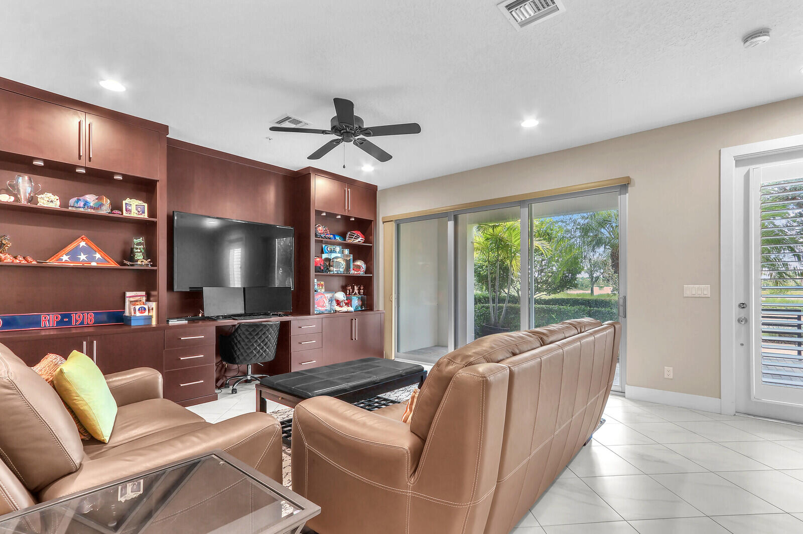 13332 Alton Road Palm Beach Gardens, FL 33418 - Photo 7 of 53 a living room with furniture and a flat screen tv