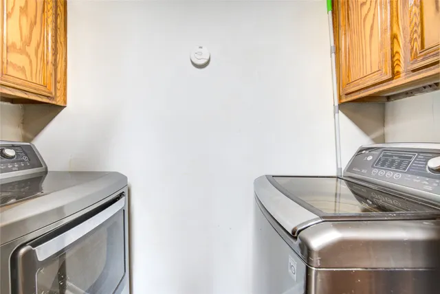 a utility room with washer and dryer