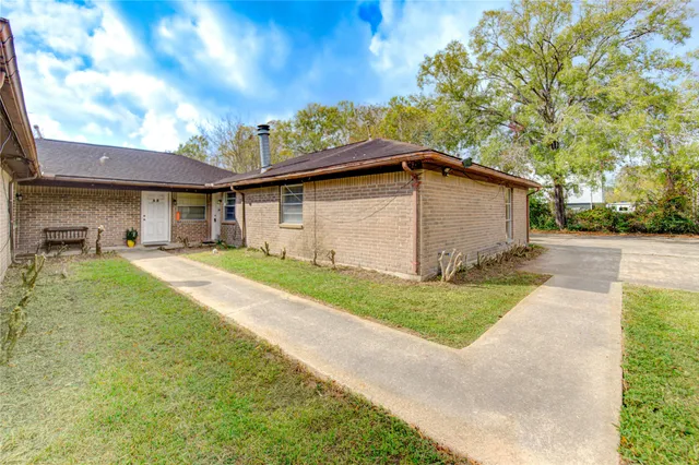 a house view with a garden space
