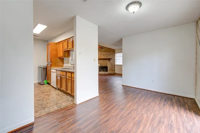 a view of a kitchen cabinets and wooden floor