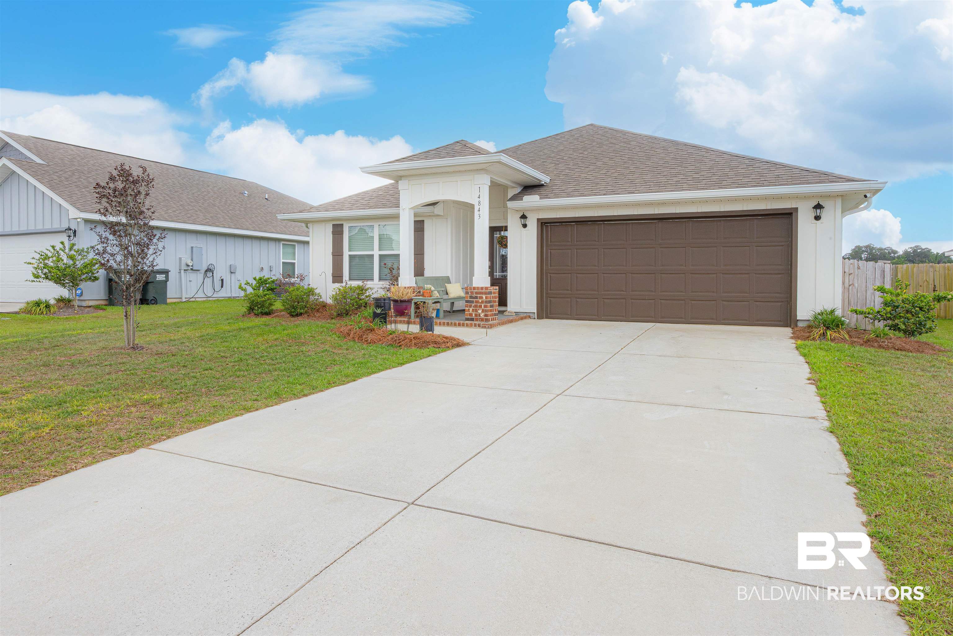 14843 Forsythia Loop Silverhill, AL 36576 - Photo 2 of 51 Ranch-style house featuring an attached garage, roof with shingles, and concrete driveway