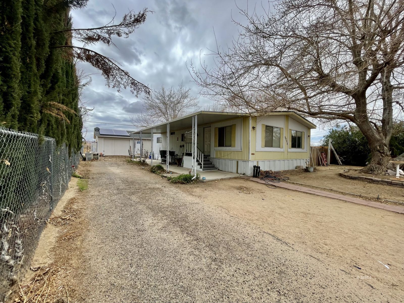5237 Nolina Avenue Ridgecrest, CA 93555 - Photo 21 of 27 a view of a house with a yard