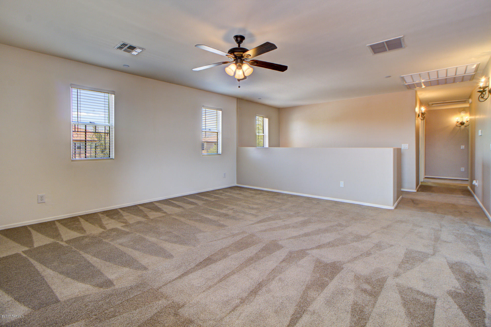3588 East Mecate Road Tucson, AZ 85739 - Photo 18 of 36 a view of a livingroom with a ceiling fan and window