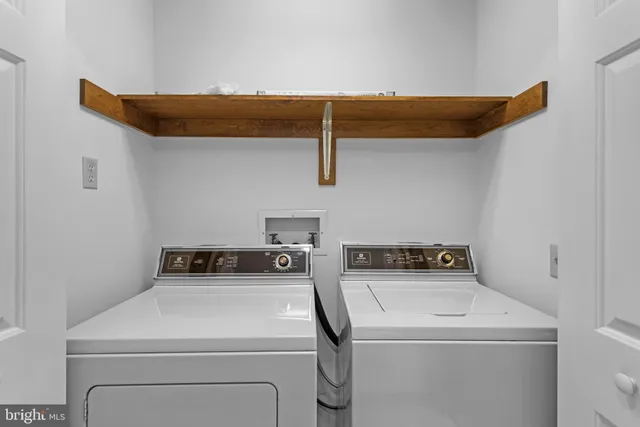 a view of a room that has a large mirror