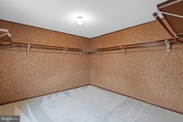 a view of an empty room with windows