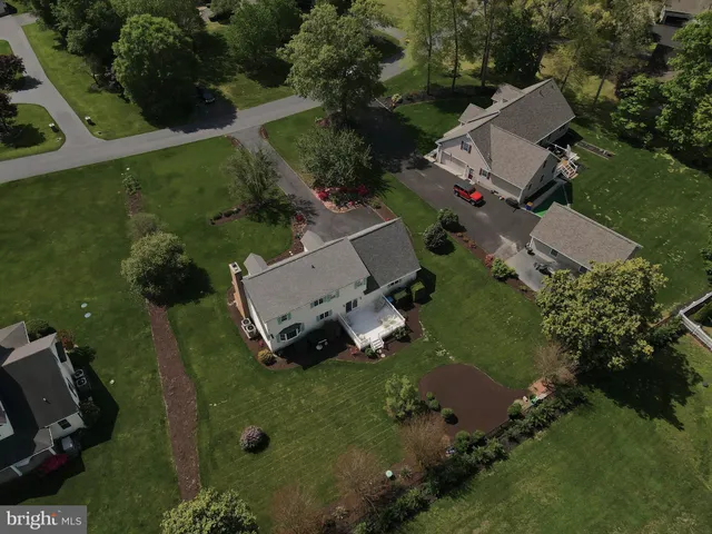 a front view of a house with a yard and porch