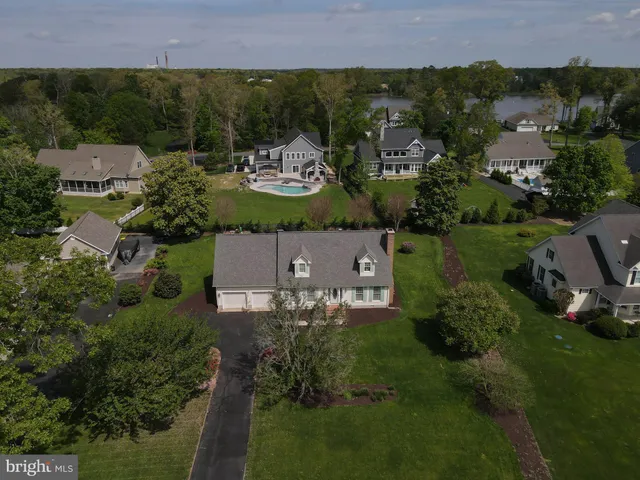 an aerial view of a house with outdoor space
