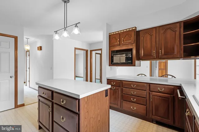 a kitchen with a sink and a refrigerator