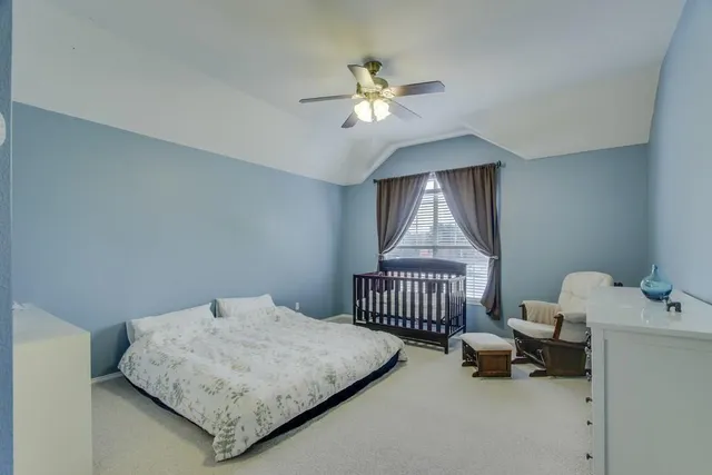 a bedroom with furniture and a window