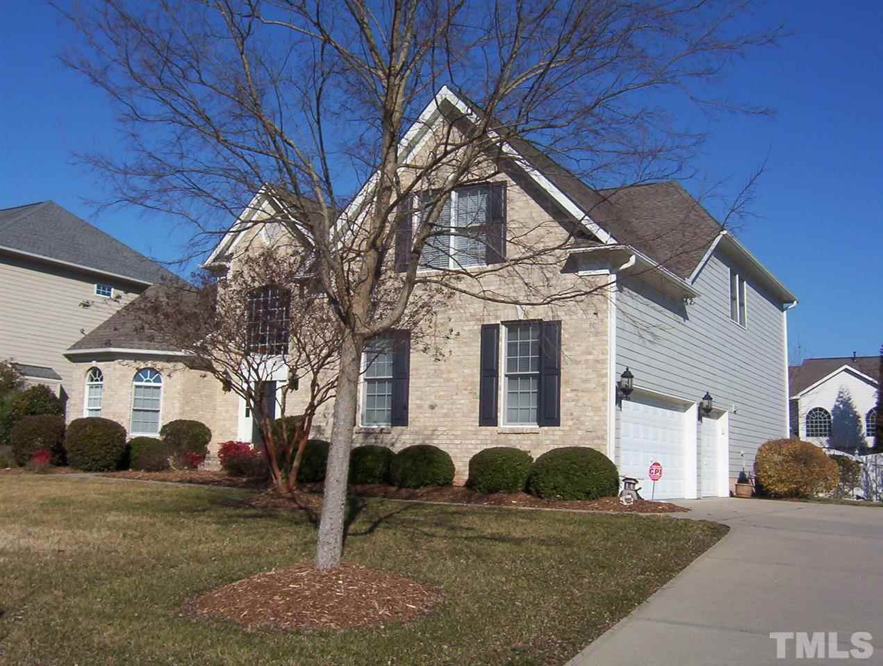 10652 Tarton Fields Circle Raleigh, NC 27617 - Photo 25 of 25 a view of a white house with a yard