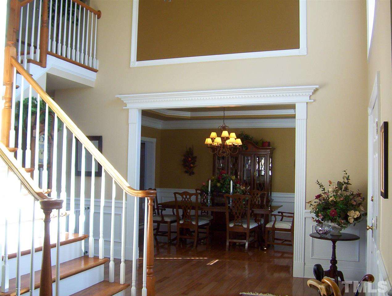 10652 Tarton Fields Circle Raleigh, NC 27617 - Photo 4 of 25 a view of a livingroom with furniture and floor to ceiling window
