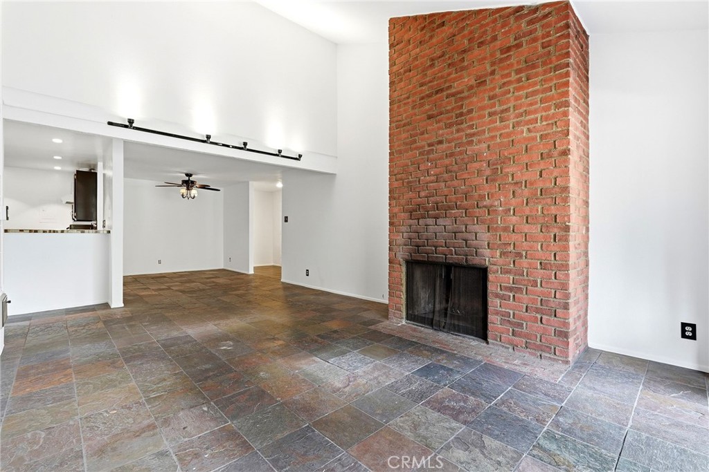 7890 East Spring Street, Unit 11E Long Beach, CA 90815 - Photo 12 of 40 a view of a livingroom with a fireplace