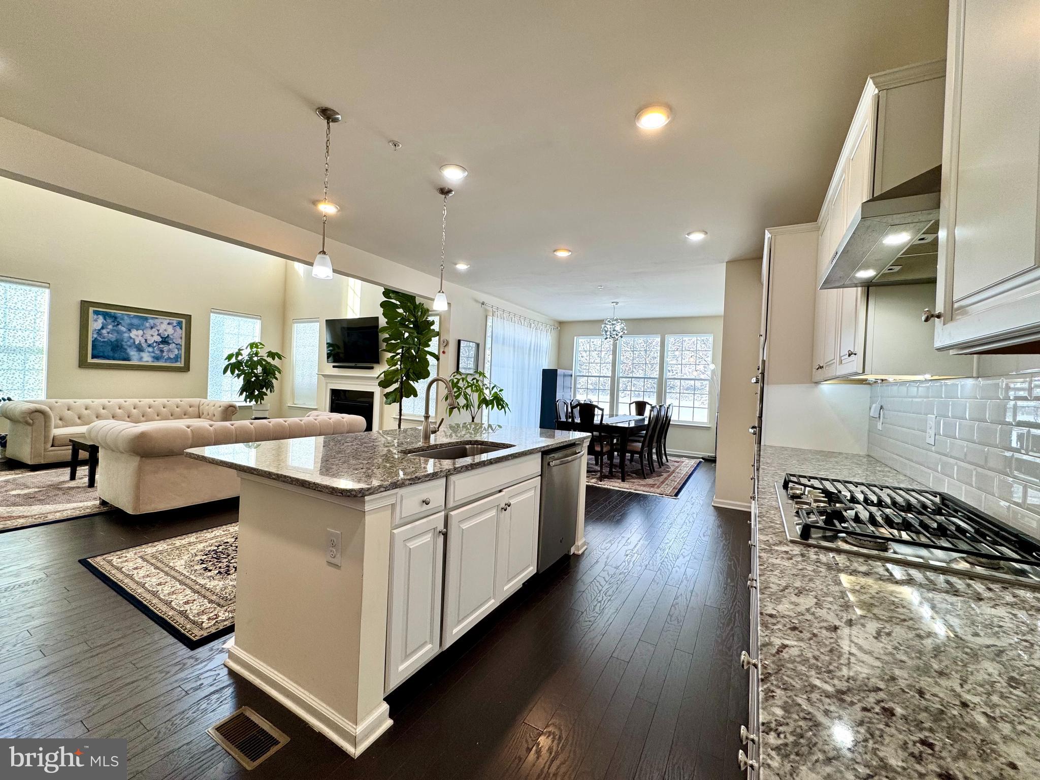 447 Lee Place Exton, PA 19341 - Photo 14 of 31 a kitchen with stainless steel appliances granite countertop a stove and a sink