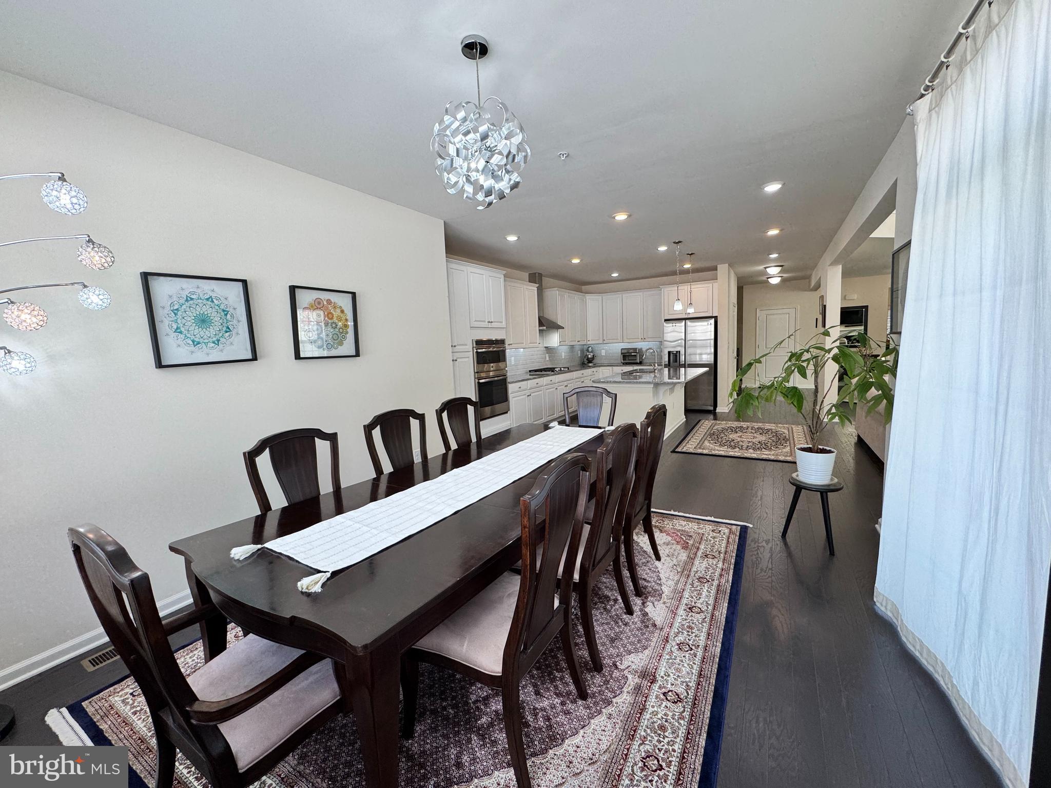 447 Lee Place Exton, PA 19341 - Photo 15 of 31 a view of a dining room with furniture and chandelier
