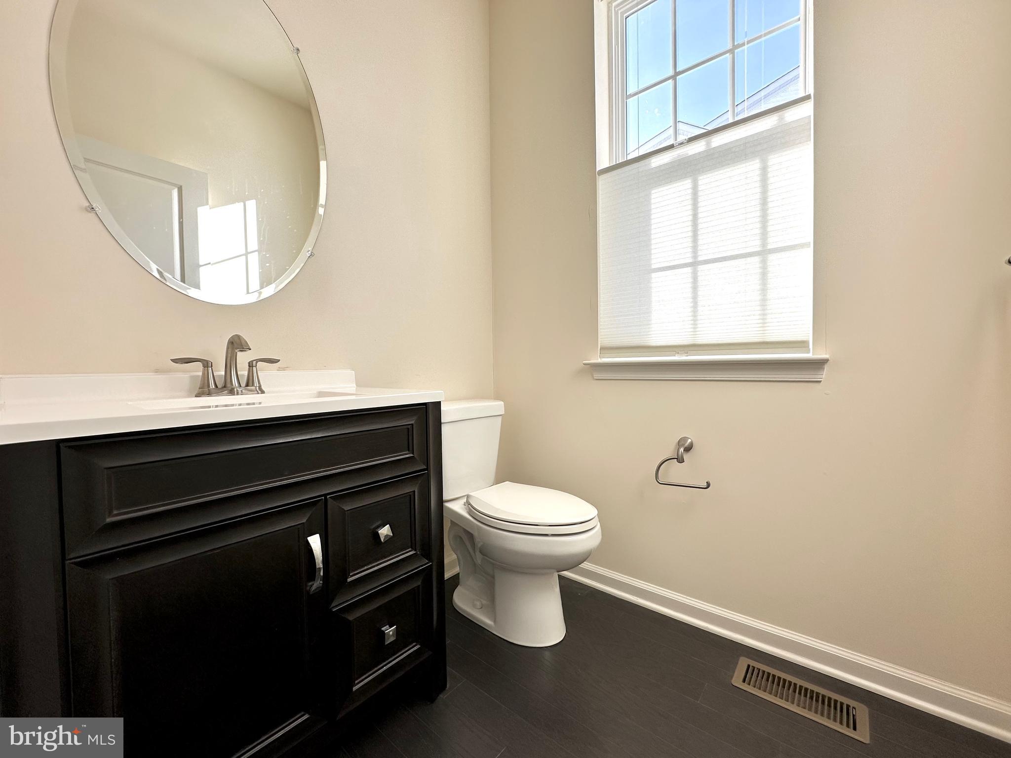447 Lee Place Exton, PA 19341 - Photo 17 of 31 a bathroom with a sink vanity and a toilet